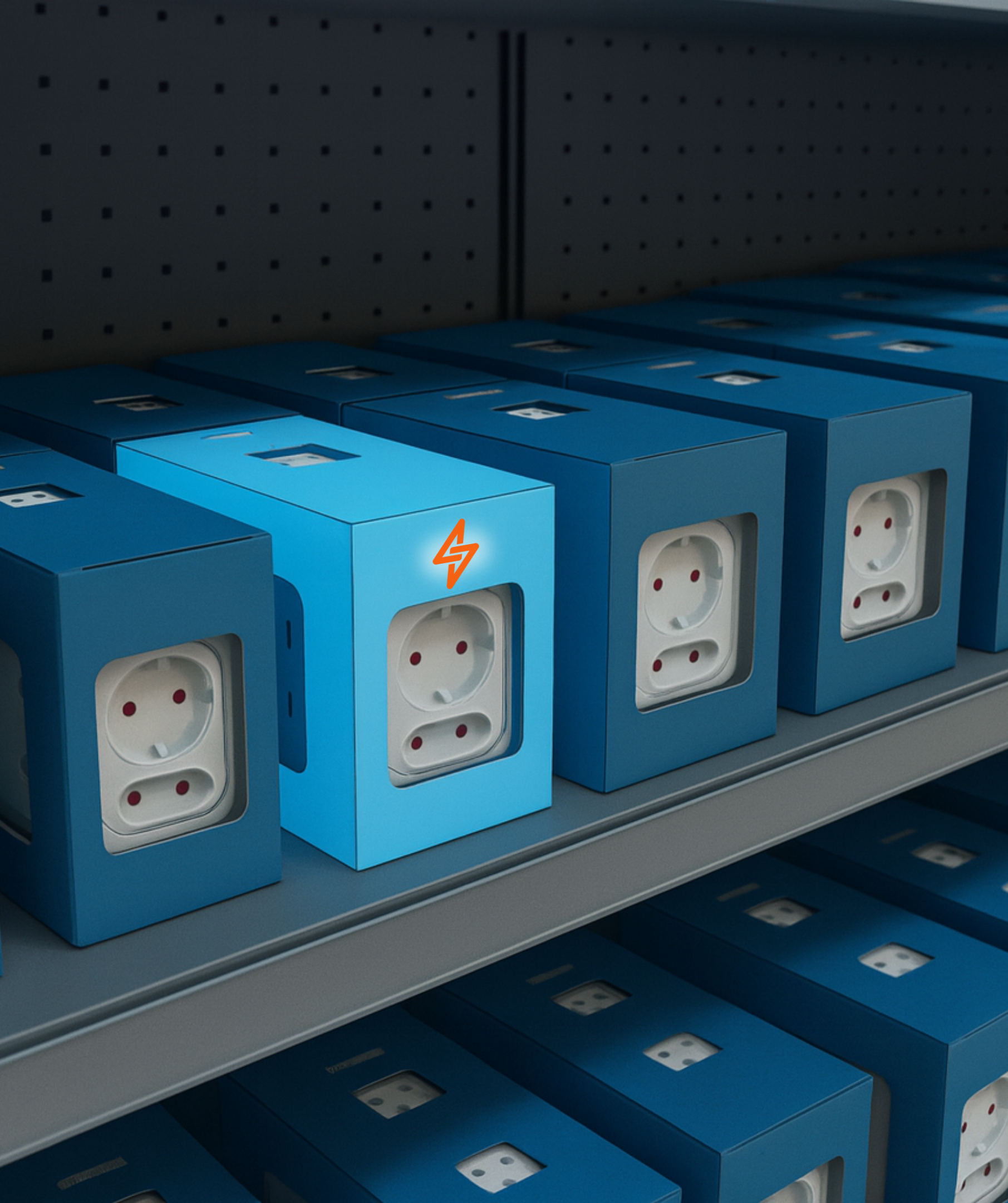 Close-up of blue socket boxes on shelf with light blue box glowing orange lightning bolt logo in center