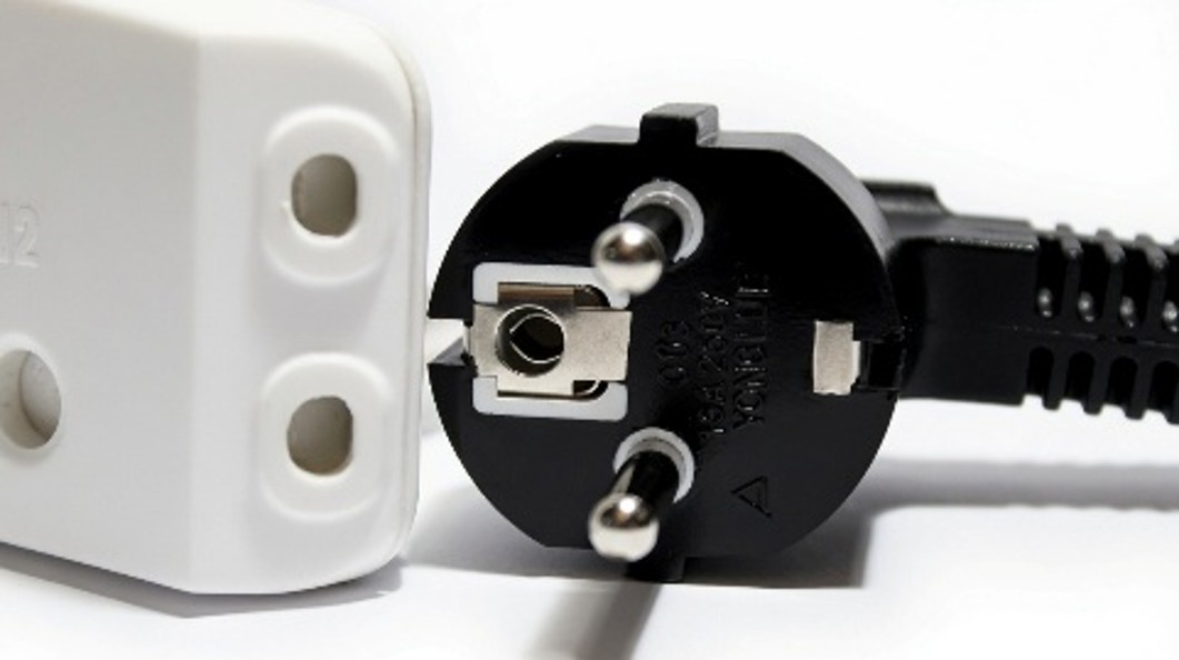 Schuko plug and two-pin unearthed adapter
