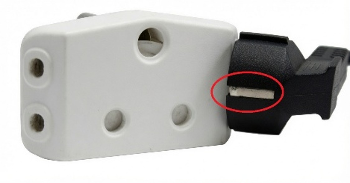 Schuko plug inserted into an adapter